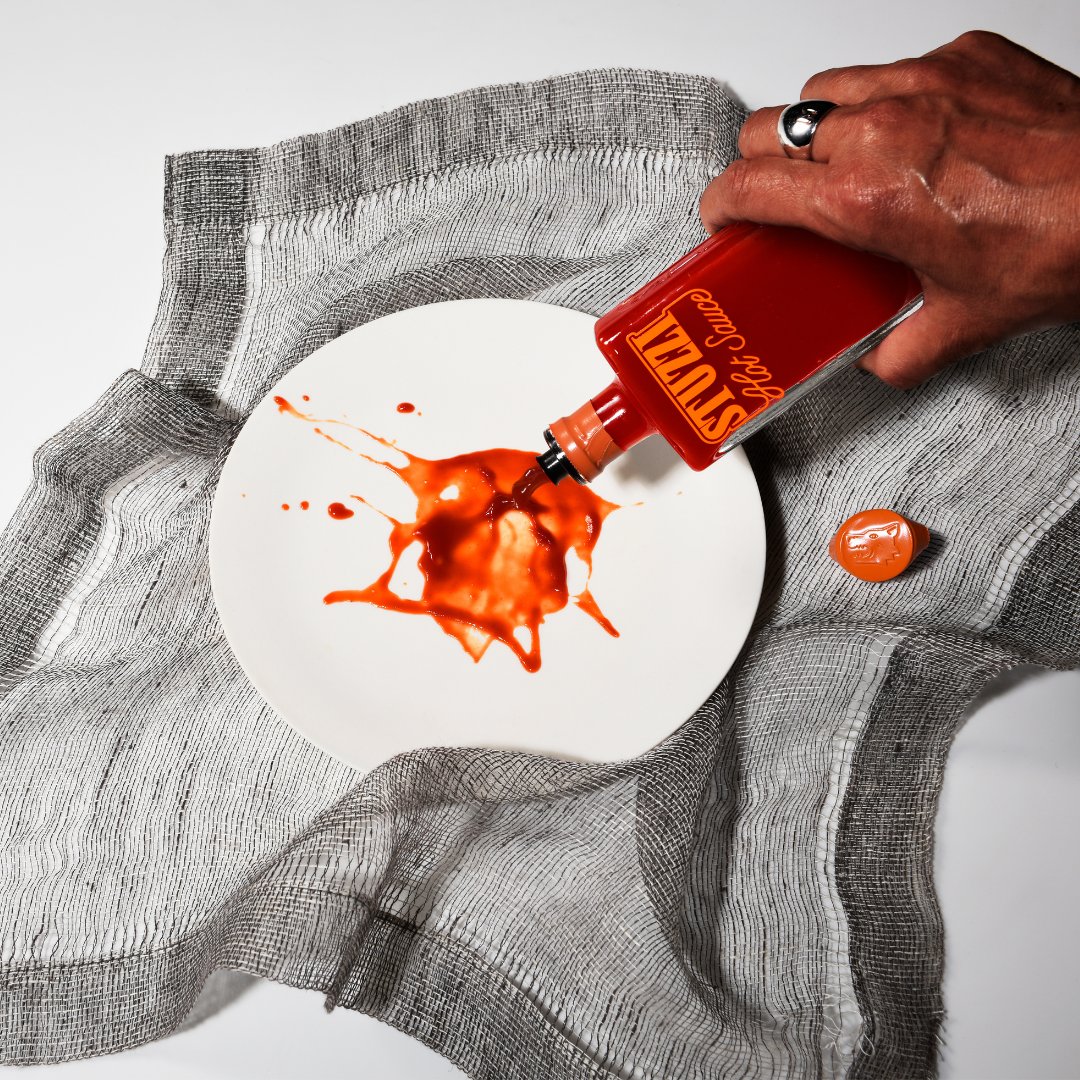 Stuzzi sauce pour on white plate